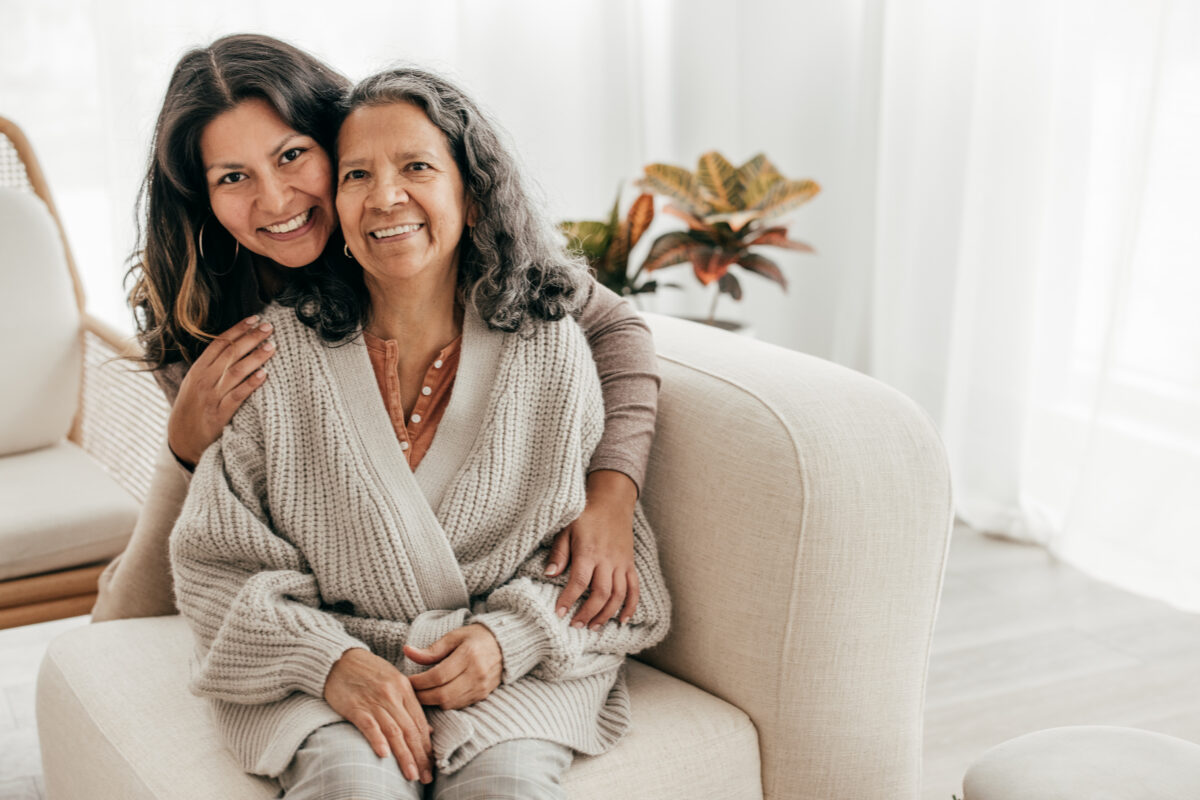 Family caregiver taking a break while a professional caregiver helps