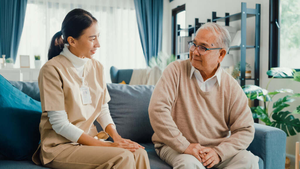 Caregiver doing a memory activity with a senior with Alzheimer's