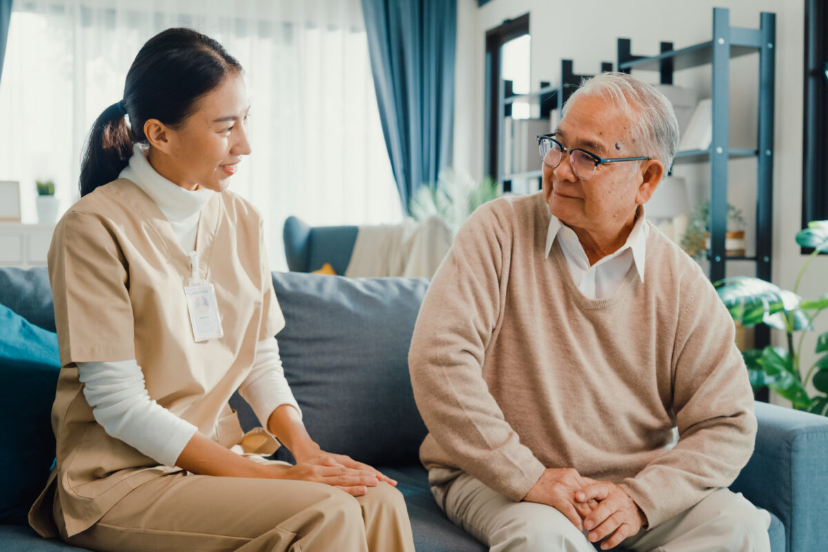 Caregiver doing a memory activity with a senior with Alzheimer's