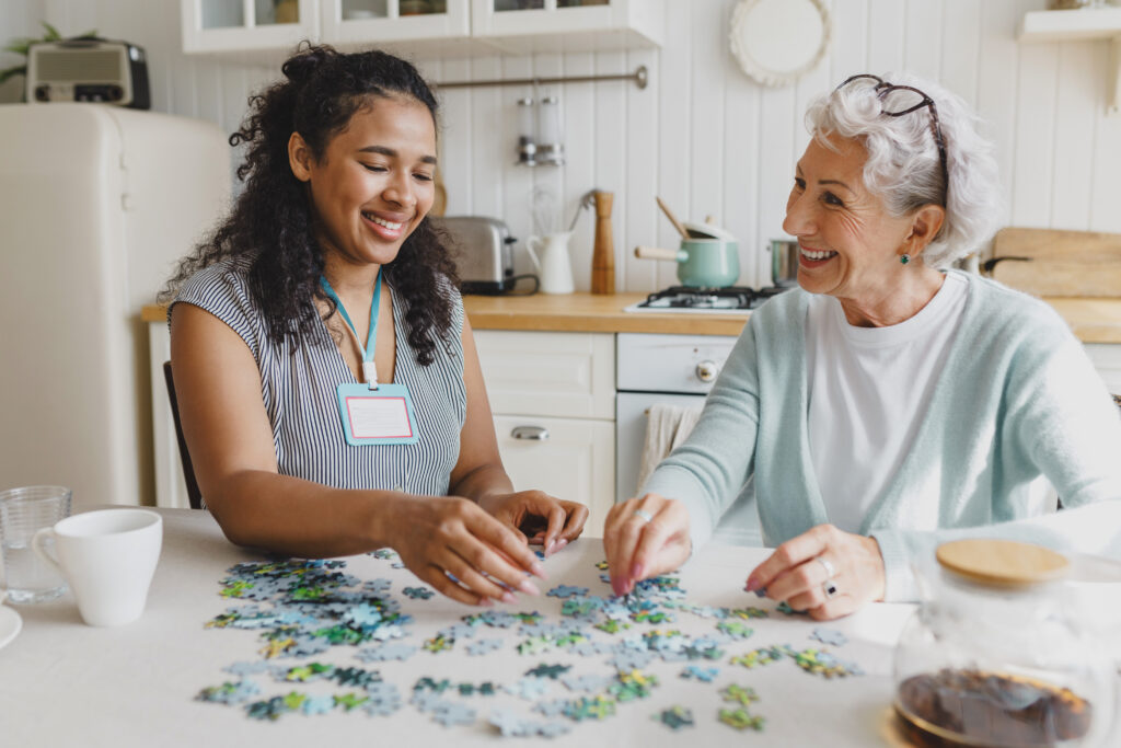 Caregiver comforting a senior with memory loss at home